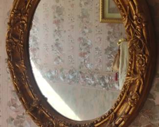 gold oval wall mirror
