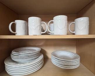 white sets of dishes and coffee mugs