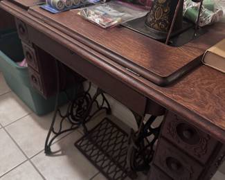 sewing supplies, ribbons, buttons, thread, two sewing machines