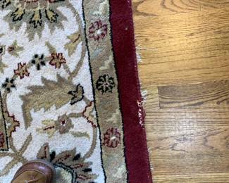 #18	machine made wool burgundy and white rug 8'x10' as is finish	 $75.00 			
