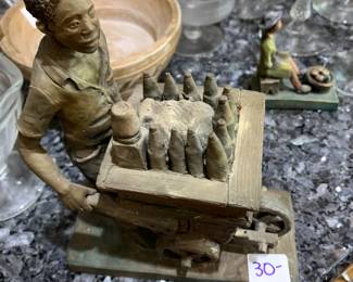 #56	Terra Cotta Statue of Man w/wheelbarrow full of bottles	 $30.00 			
