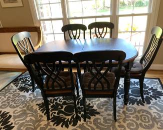#20	black painted table with wood top with 6 chairs 60x42x29	 $200.00 			
#21	indoor/outdoor black and cream rug 79x112	 $75.00 			
