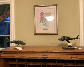 #26	model helicopter UH60L Blackhawk down	 $40.00 			
#27	Sikorsky UH60L Black Hawk model helicopter 1:48	 $60.00 			
#25	roll top desk with 8 drawers 48x32x48	 $100.00 			
