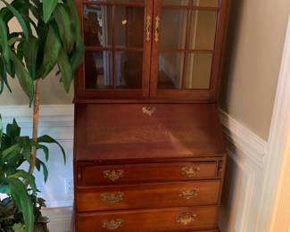 #115	2 piece Secretary Wood Secretary w/drop-down Front & Cubbies w/2 Glass doors & 3 Drawers w/pull-out desk w/2 wood shelves- 30x17-27x72	 $175.00 			
