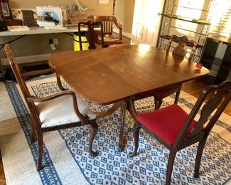 #126	Machine Made Blue & White Rug - 8x11'	 $75.00 			
#127	Wood Drop-Leaf Table w/Brass Feet w/4 chairs - 19-50x40x29	 $100.00 			
