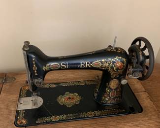 #22	treadle singer sewing machine, 4 drawers	 $75.00 			
