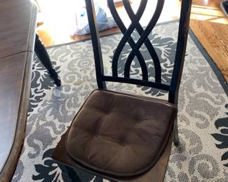 #20	black painted table with wood top with 6 chairs 60x42x29	 $200.00 			
#21	indoor/outdoor black and cream rug 79x112	 $75.00 			
