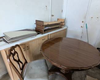 Dining room table and four chairs
This table also includes three leaves, pictured in the back....take your dinner party to sit eight people. Padded table protectors also included.