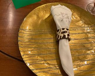 Gold charger plate with silver sparkle zig zag lines | vintage cloth, hand embroidered napkin | bone, hand painted napkin rings.