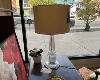 Heavy crystal lamp with soft beige shade.