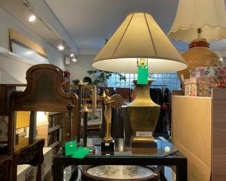 Tall black steel taper candle holders with brass incense covers.