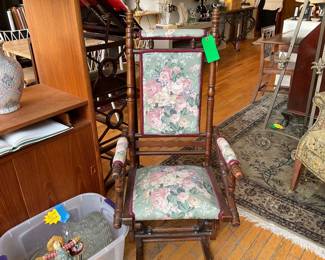 Antique carved wood and floral rocking chair