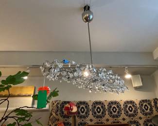 Crystal and metal contemporary pendant lamp, chrome and silver base.