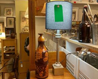 Haitian wood carved sculpture with hidden compartments | silver painted lamp base, lightweight with navy cotton lamp shade.