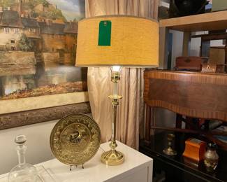 Tall brass standing candle stick style lamp with mid-century, bur lapped lamp shade. | Brass hand hammered ship display/wall handing plate