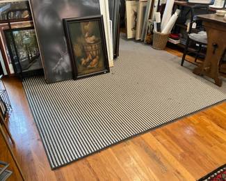 Black and White stripped wool rug | Assorted artwork, oil-painting, handing painting, assorted posters.