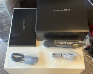 Olympus OM-D Box (no camera) with camera strap, power cable and user manual