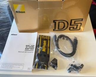 Nikon D5 Camera Box (no camera included) with manual, camera strap, usb cable and a couple small adapters
