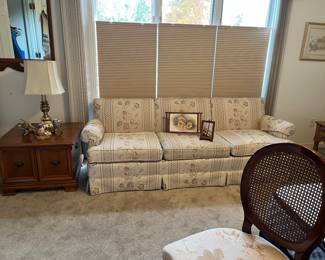 Sofa, maple end table, bird decor