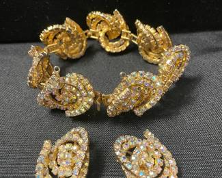 Alice Caviness Aurora Borealis Rhinestone clip on earrings and matching bracelet. These two items will be priced separately. You will need to ask to see them.