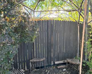 Vintage wrought iron gazebo with corner seats