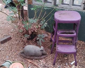 Old kitchen stool painted pink armadillo statue
