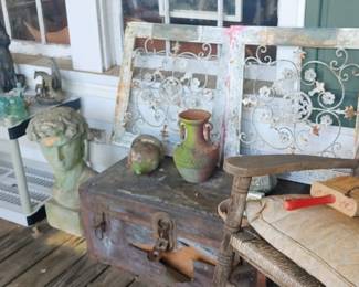 Old stuff on the front porch Pottery bottles concrete statues Etc