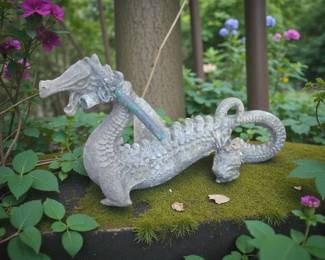 Antique Concrete dragon. Tommy had made a makeshift Fountain out of this and tied a hose to the neck of the Dragon & and it was sitting on the side of one of the fish ponds