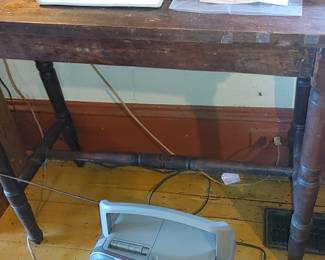 Tommy's antique writing desk this was in The Pasley Hotel 
Dovetails joints beautiful turns legs with stretcher in the middle they find piece of furniture