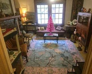 The Farmhouse is Charming With Antiques And lots of Eclectic items. Pink tinsel Christmas tree is really pretty too