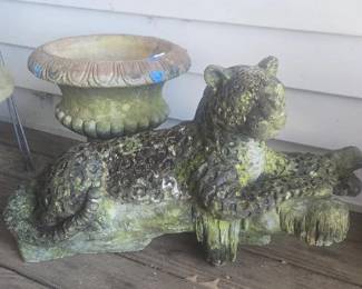 Rescued from the jungle out back this beautiful concrete  leopard was sitting on one of the large rocks on the property