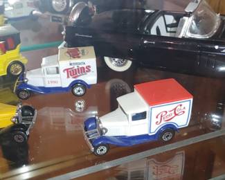 Vintage 1979 Matchbox Superfast Model A Ford Pepsi-Cola Truck 

Matchbox 1990 Minnesota Twins Model A Ford die-cast model truck

Matchbox Models of Yesteryear 1907 Peugeot diecast toy car. This specific model is known as the Y-5 and was first produced by Lesney Products in 1969. 

The model is a replica of a Peugeot Victoria Top Phaeton produced between 1907 and 1913. 
It is typically made in a 1:43 scale. 
Variations exist in color, with common ones being orangey-gold or yellow bodies with a black roof and red seats. 

Ford Model A Delivery Truck with the University of Colorado (CU) Buffaloes logo. 

Revell 1956 Black Ford Thunderbird Convertible 1:18 Scale Diecast  Car