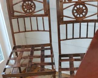 Antique wrought iron cast iron and bronze chairs Sunburst in the middle dolphin Motif on the top
I think there are three 