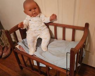 super cute doll crib with a big baby
