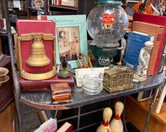 Antique nut vending machine, book ends, vintage bowling pins, coffee table books and more