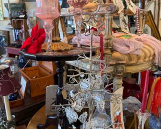 glass Christmas ornaments, chairs, pink candleholders, vintage tables