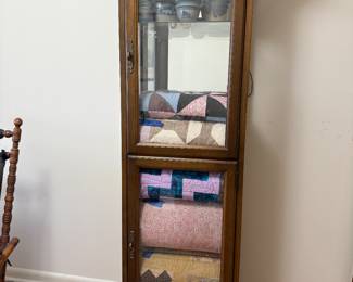 Antique quilts and cabinets