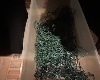 Plastic tote of net lights for bushes