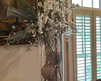 Large glass containers with flowers