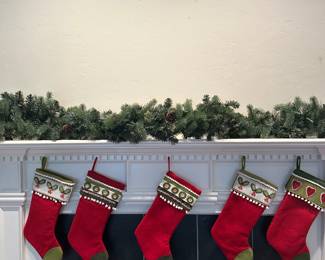 5 stockings and mantle garland from Esposito with lights