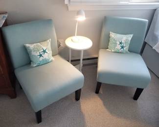Two teal accent chairs; accent table; table lamp