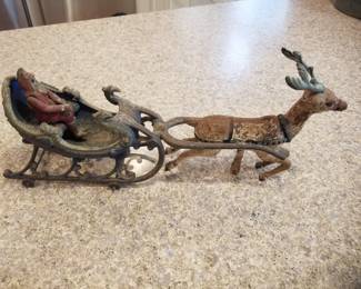 Vintage cast iron Santa with sleigh & reindeer
