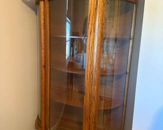 Oak curio/China cabinet with curved glass 