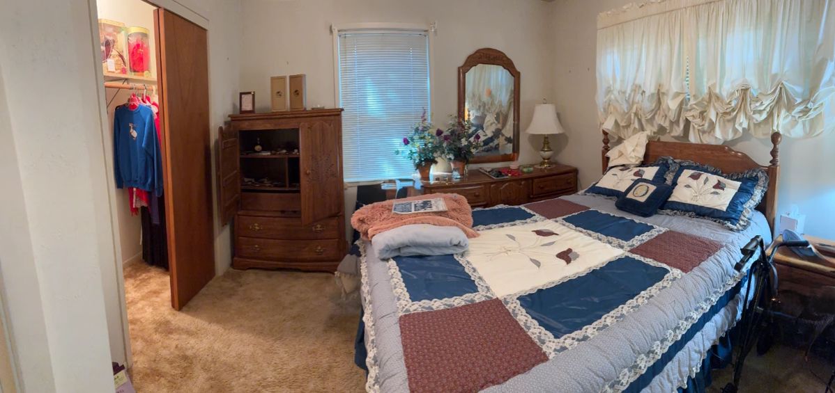 Country bedroom suite (armware, dresser, mirror and bedside table, and also a comforter and shams. 