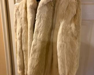 Women's cream-colored fur coat