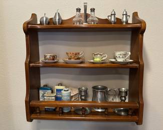 Wall shelf with salt and peppers, Demitasse cup and saucers, pewter, and vintage talc metal containers