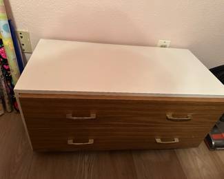 Nice low one drawer cabinet rolls into closet easily great extra storage
