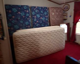 Three twin beds with frames. One twin bed without frame. Compartment Headboards. Mirror.