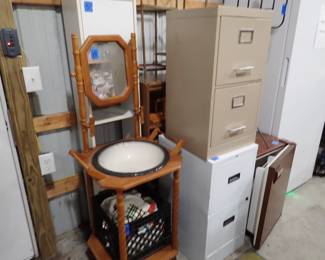 Filing Cabinets. Washstand. Small Refrigerator. Shelves. TV. Countertop.