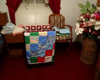 Quilts. Chairs. Silk Flowers. 